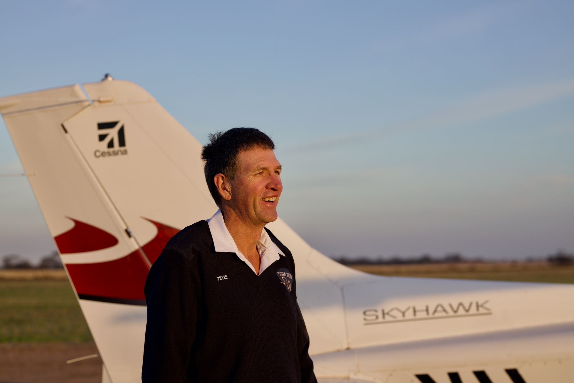 Peter beside the Cessna 172 Skyhawk at sunset